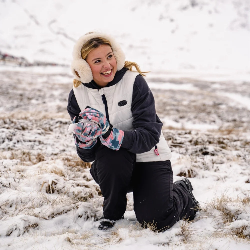 Person in winter clothing posing in a snowy field