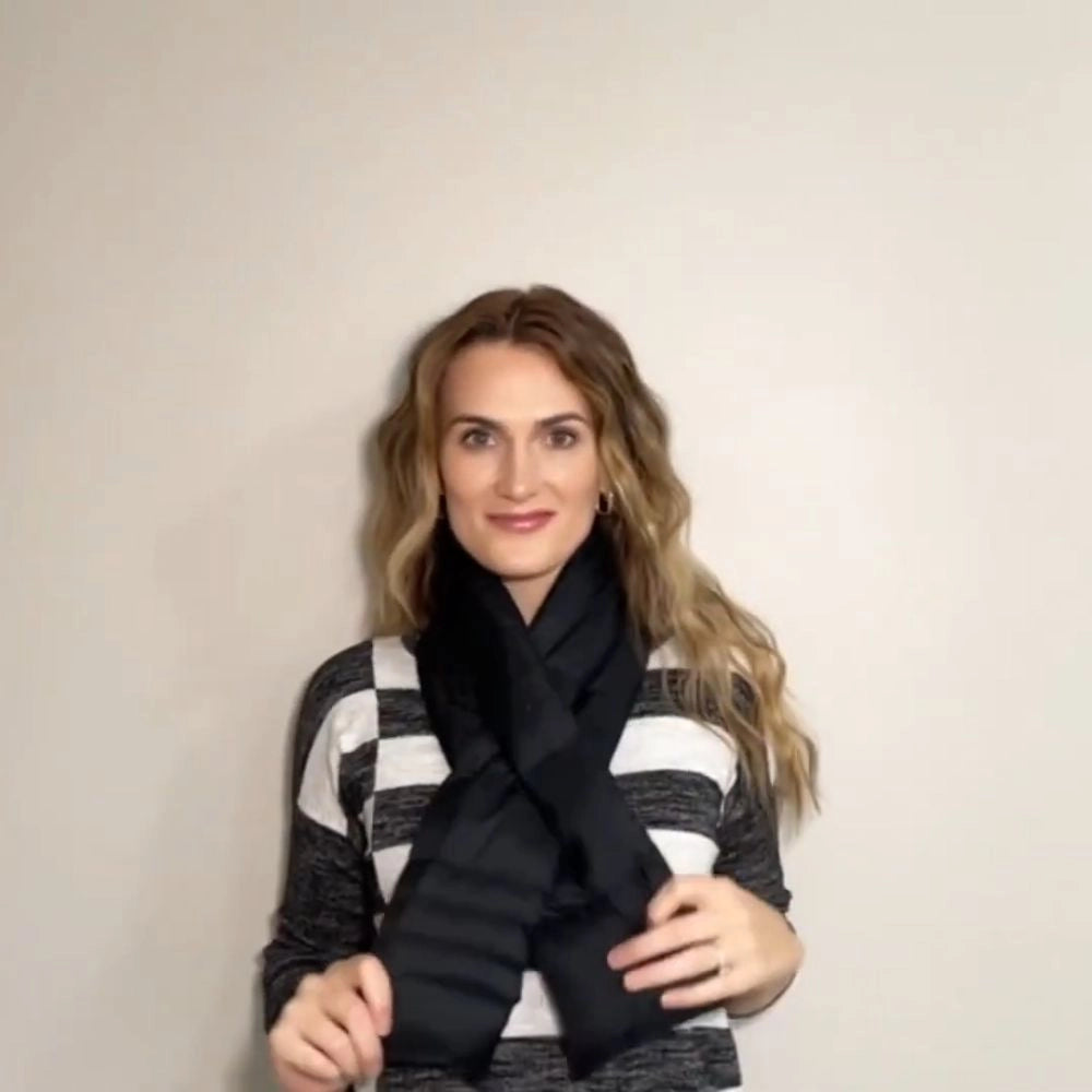 A woman wearing a black scarf